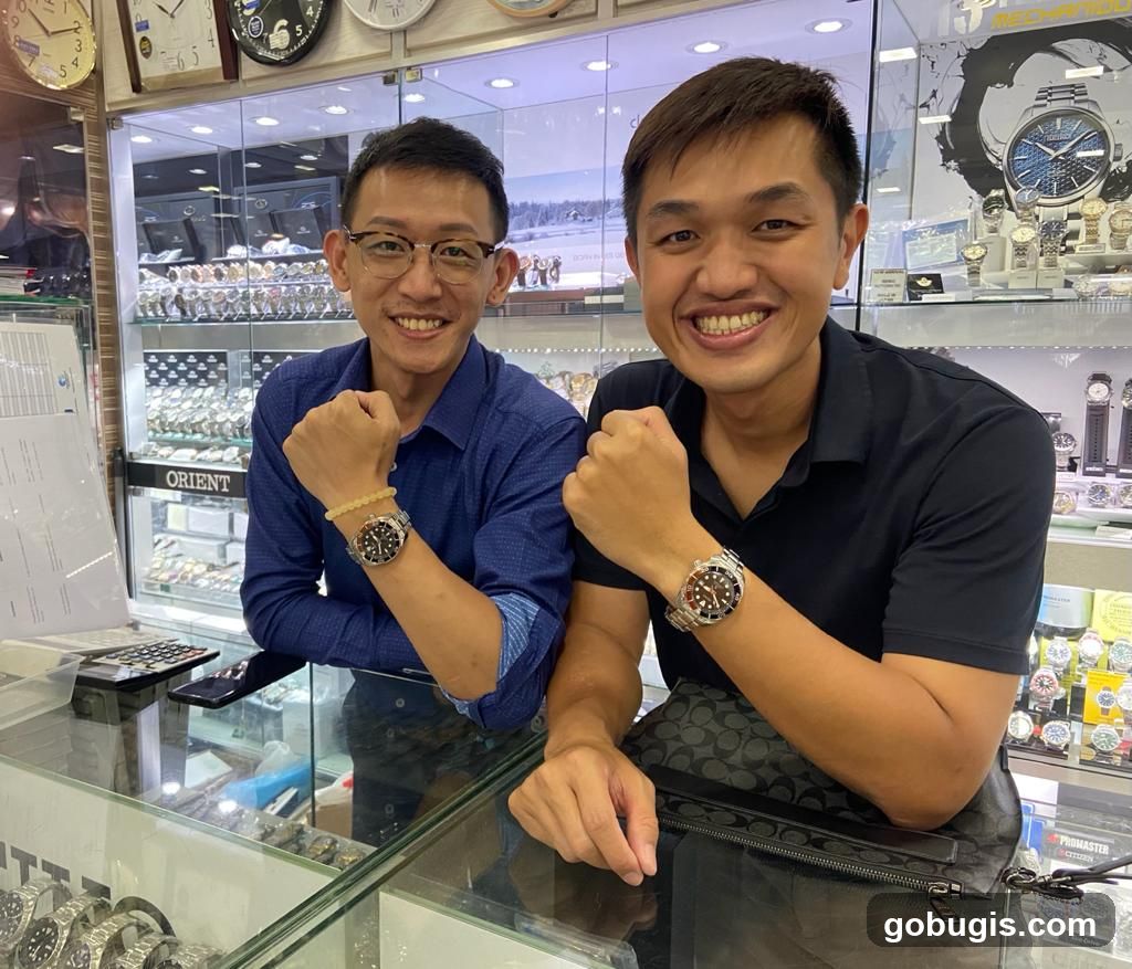Two men showing off watches