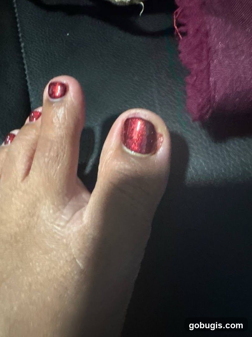 Toes with Red Glitter Nail Polish