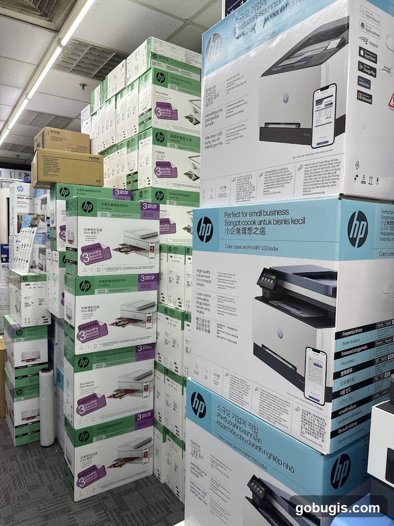 Stack of HP Printers and Other Electronics Boxes