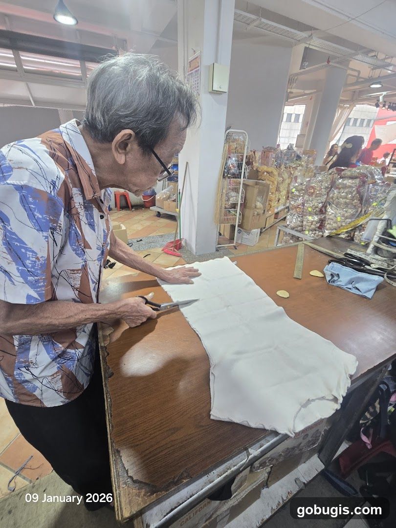 Man cutting fabric