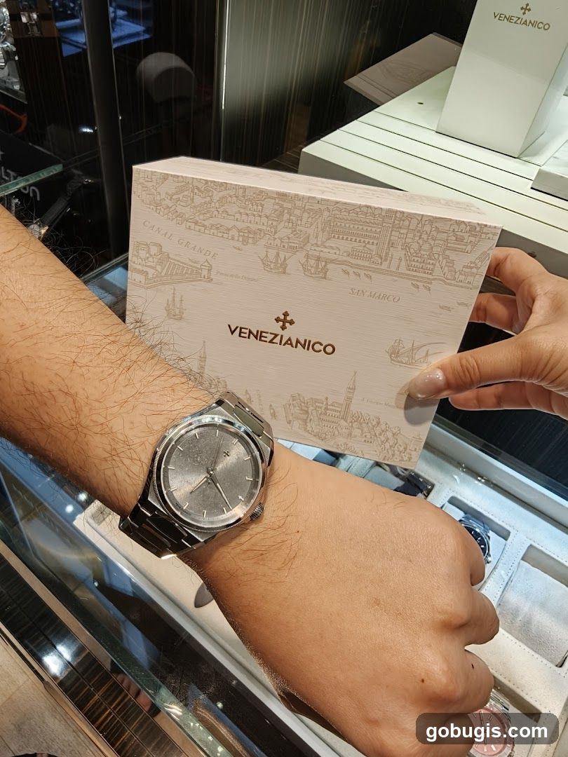 Watch on wrist with branded box