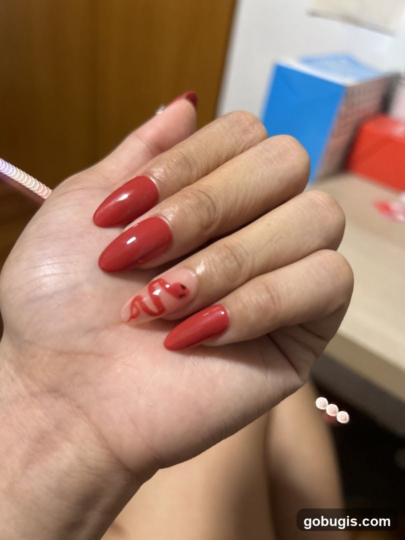 Red Almond Nails with Snake Design