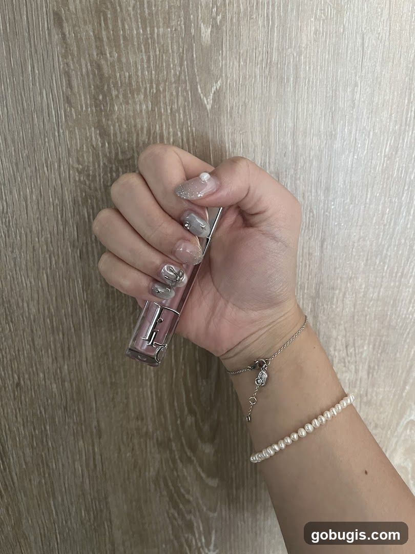 Hand holding a lipstick