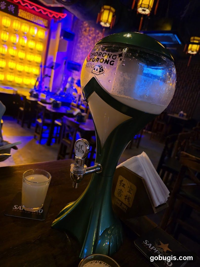 Soju dispenser and drinks on a table