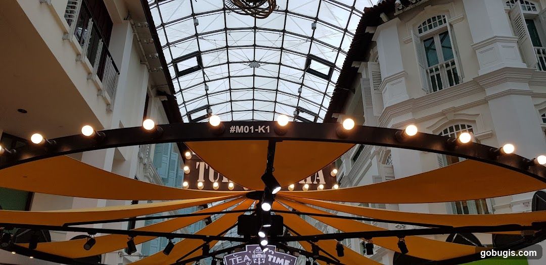 Outdoor seating area with decorative lighting and canopy