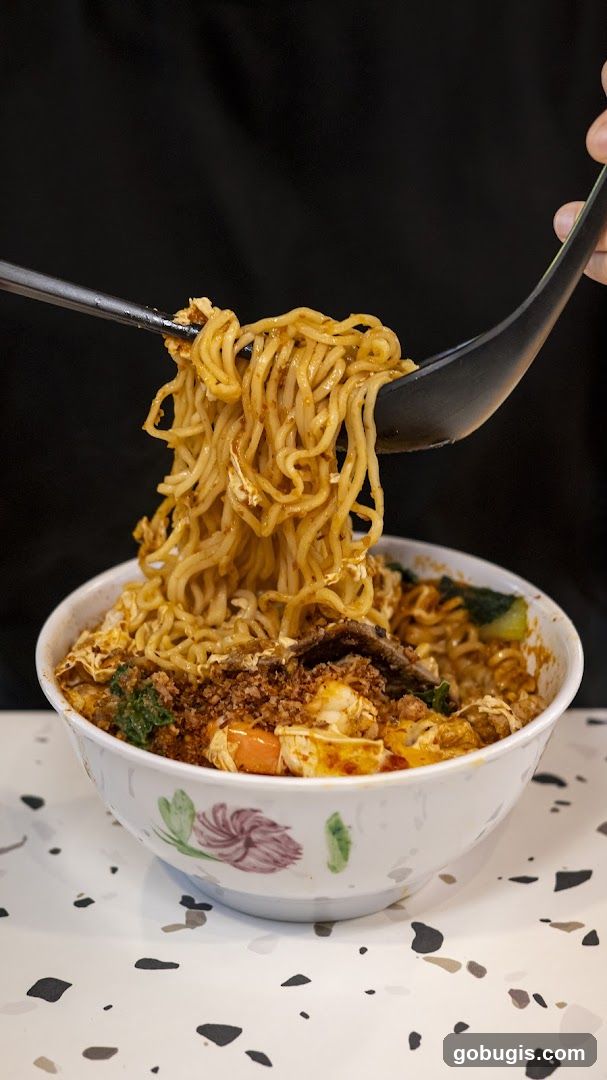 Noodles being lifted from a bowl