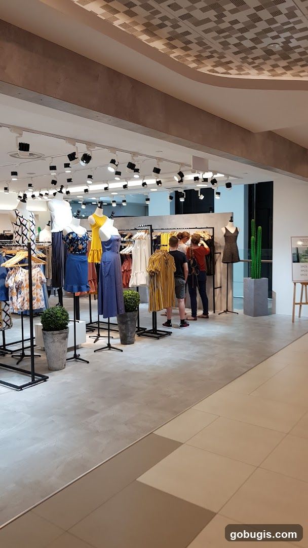 Clothing store interior with mannequins and racks