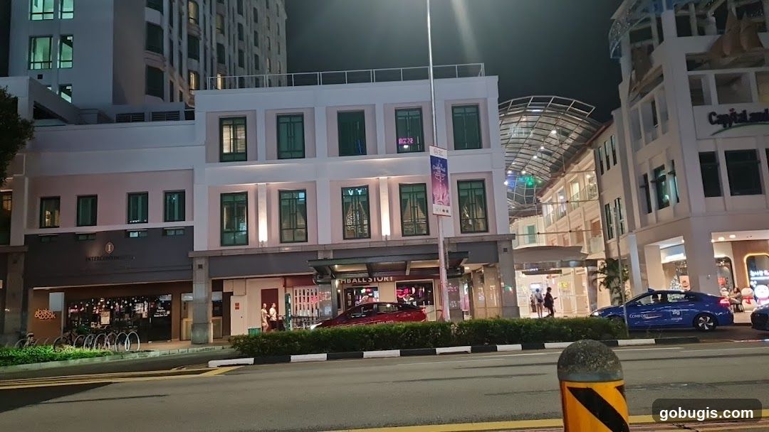 Nighttime street view of a commercial building