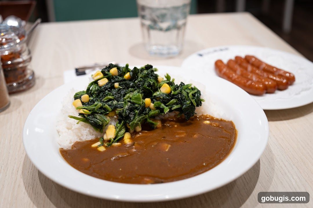 Curry with Spinach and Corn, and Sausages