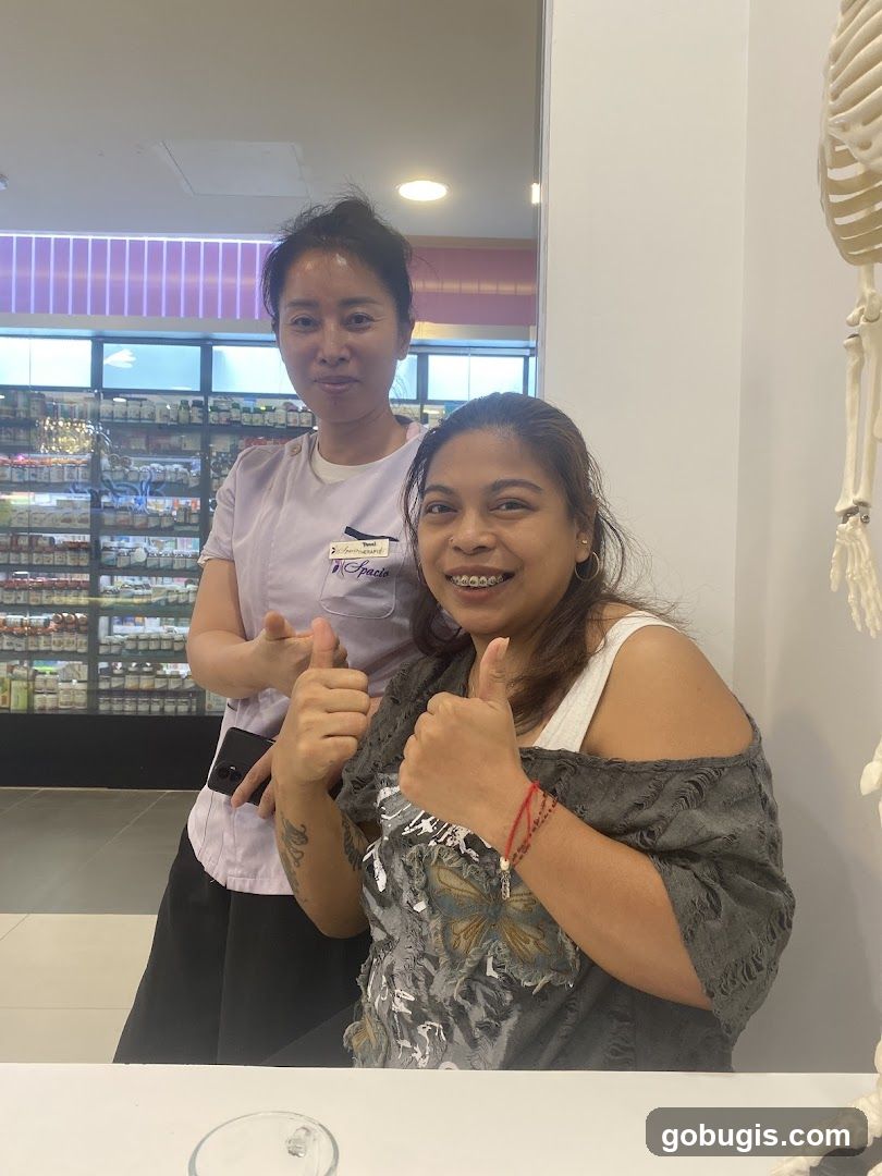 Two Women Giving Thumbs Up