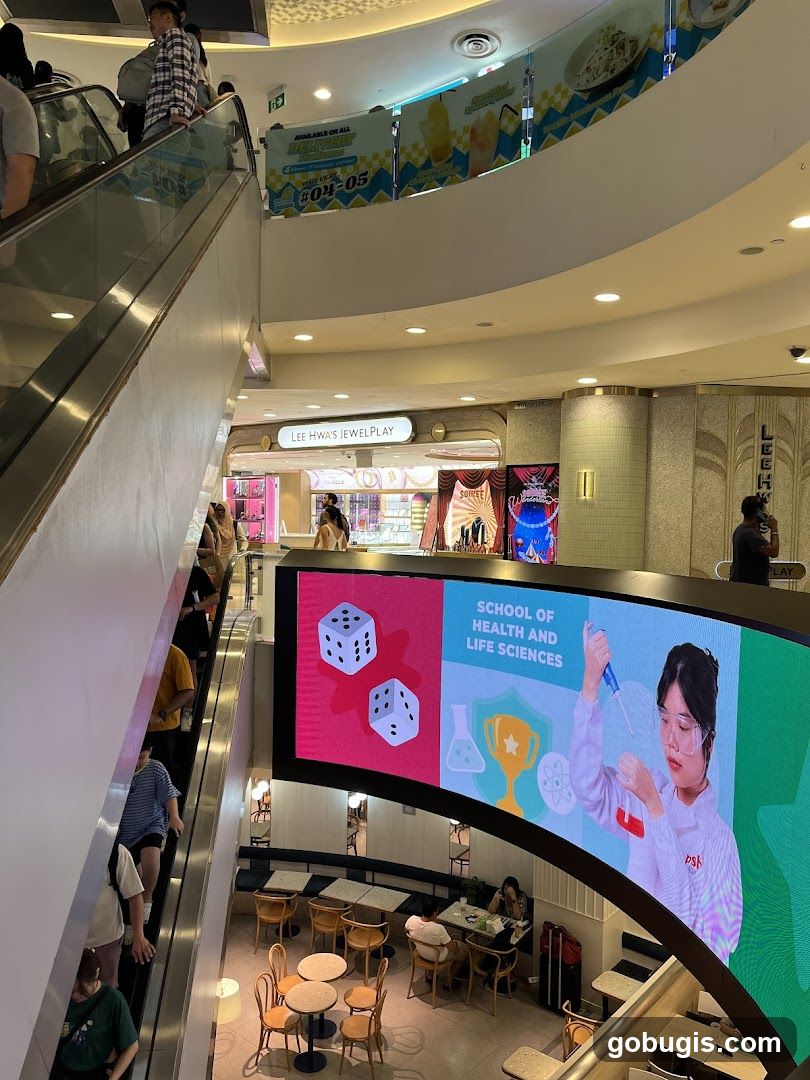 Mall Interior with Escalator and Digital Display