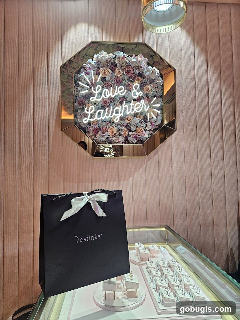 Jewelry store display with floral decor and neon sign