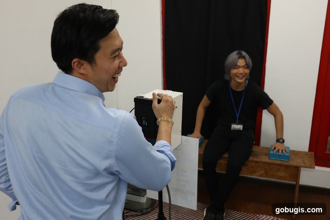 Two men laughing in a room