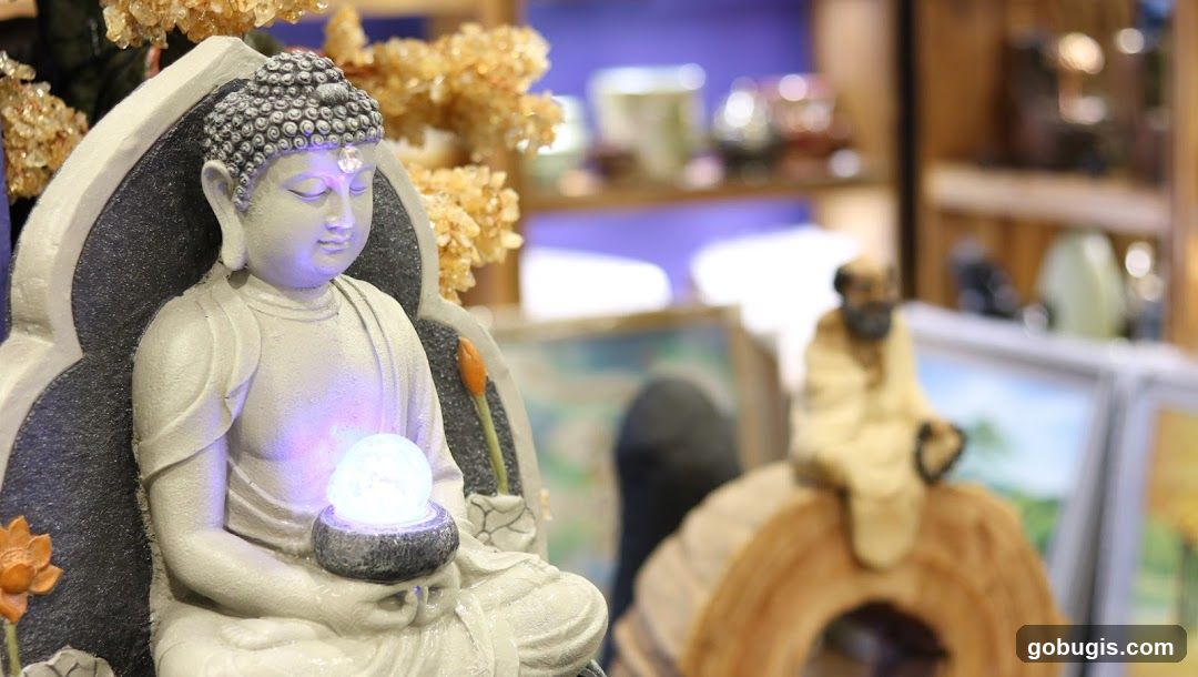 Buddha statue with glowing orb