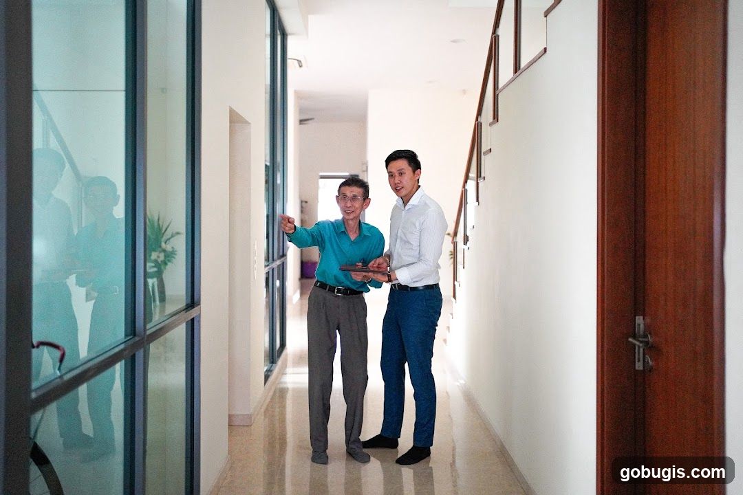 Two men in a hallway