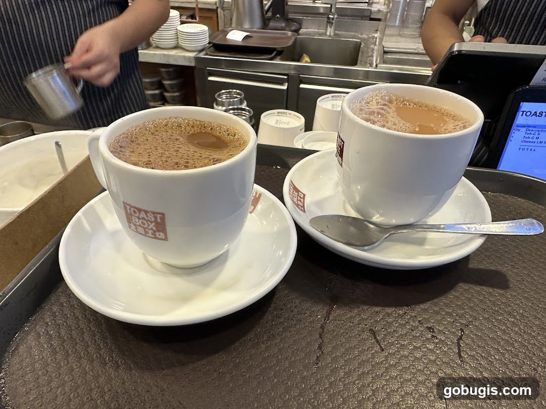 Two cups of coffee on a tray