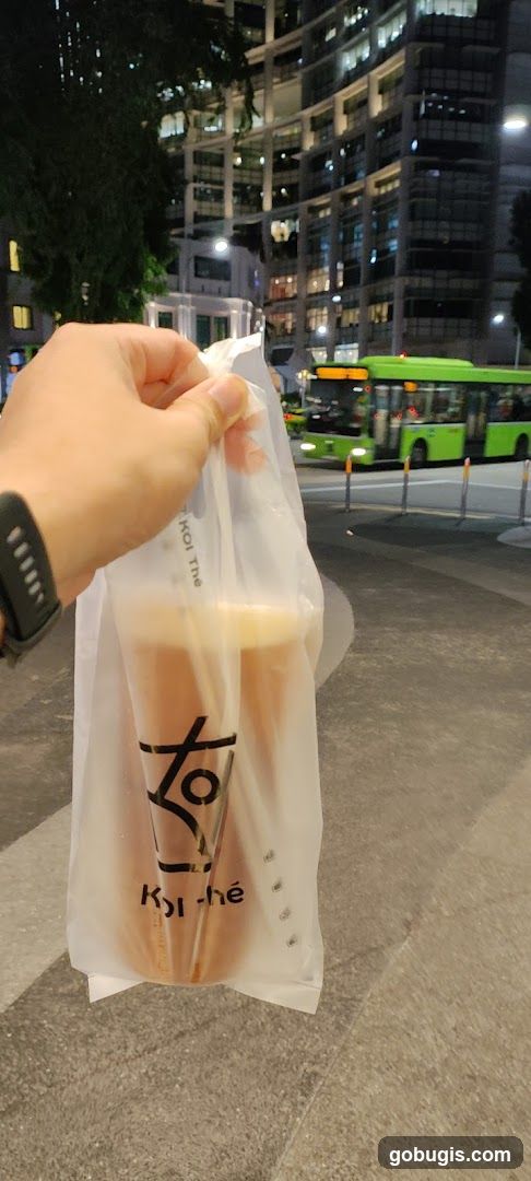 Person holding a drink bag