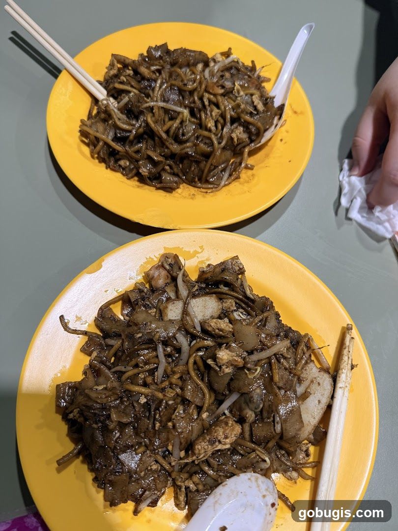 Two plates of Char Kway Teow