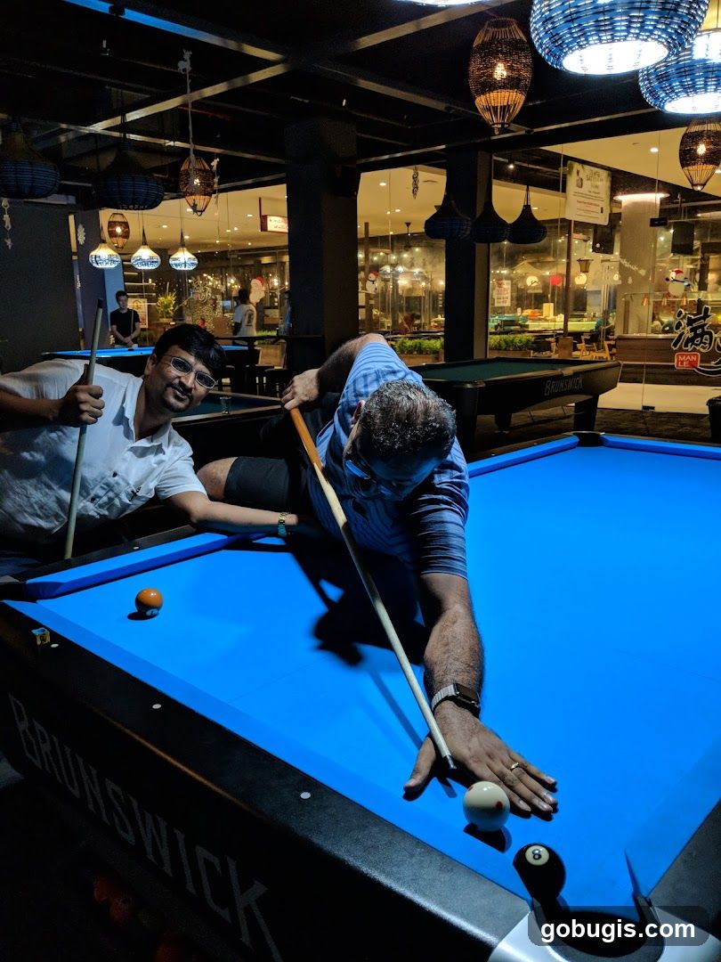 Men playing billiards