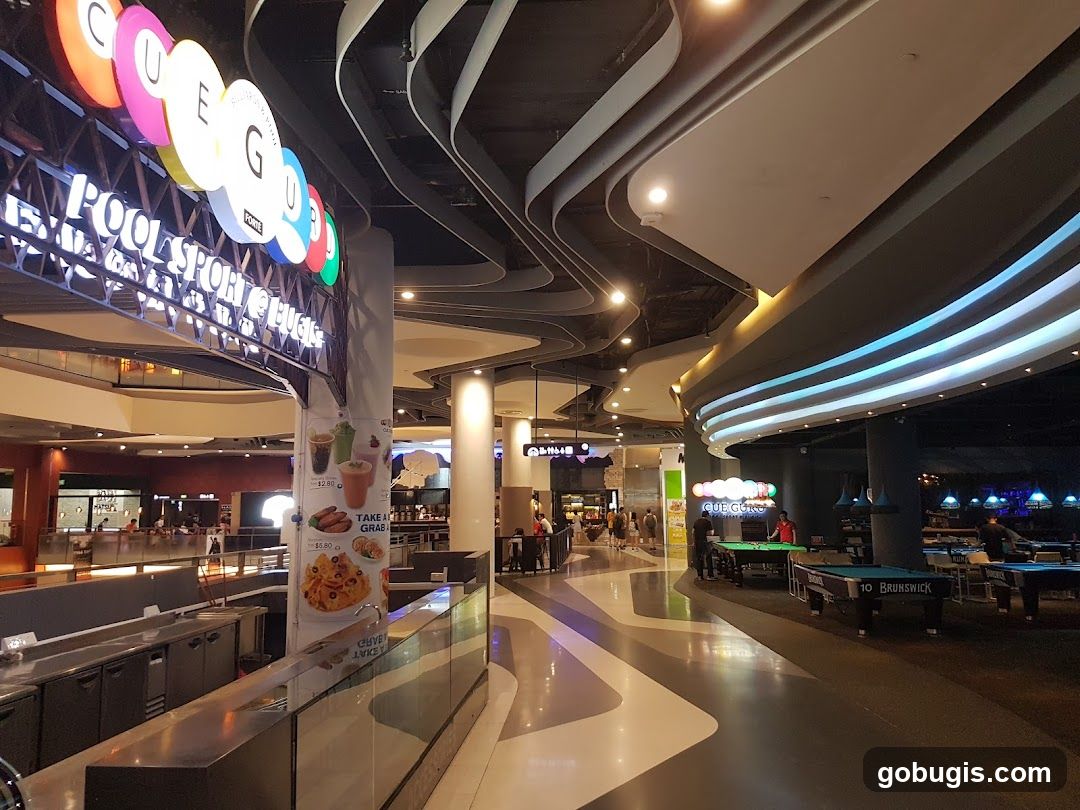 Indoor entertainment venue with pool tables and food stalls