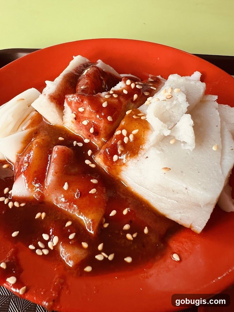 Chee Cheong Fun with Sauce and Sesame Seeds
