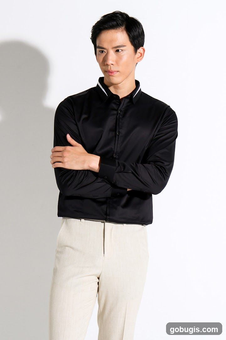 Man in Black Shirt and Tan Pants