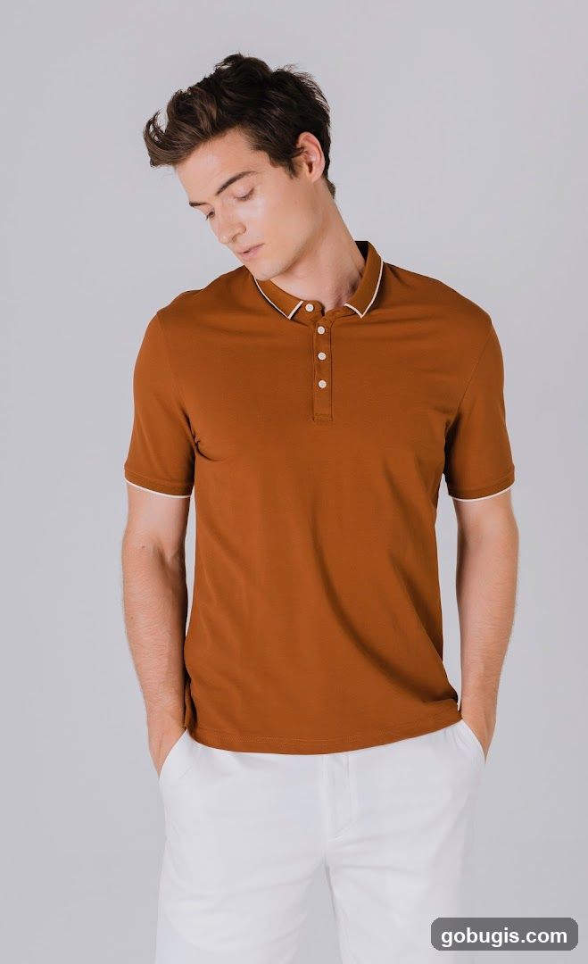 Man in a brown polo shirt and white pants
