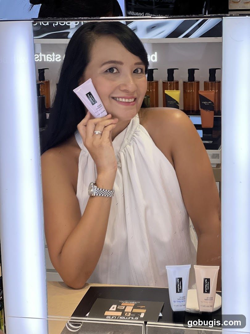 Woman holding a tube of cosmetic product