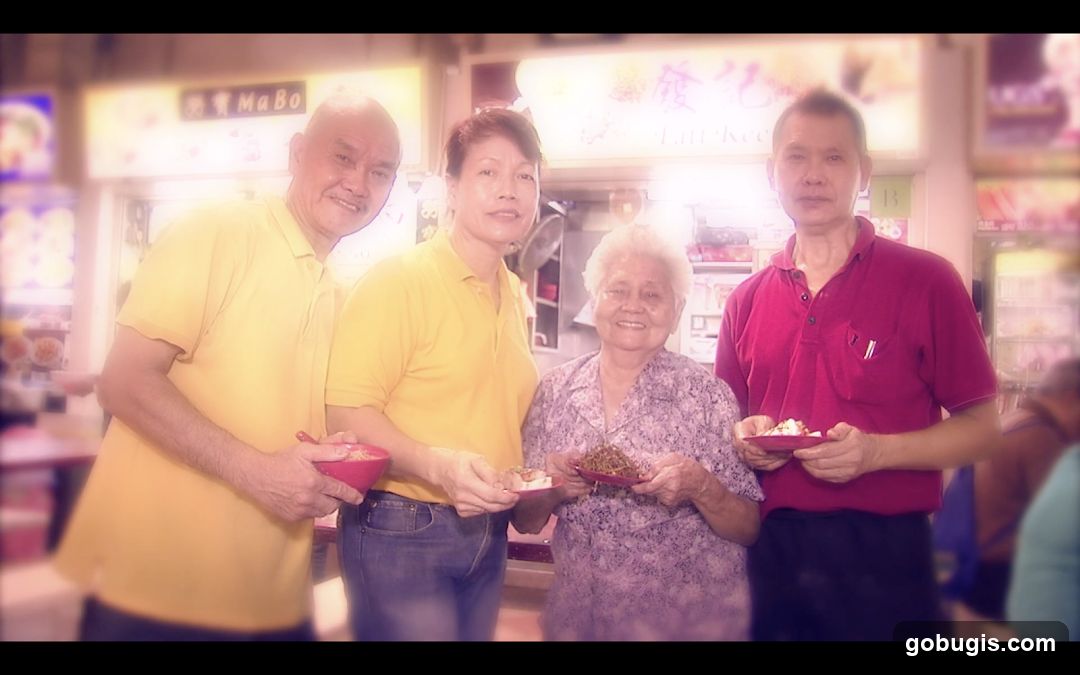 Four people holding food bowls