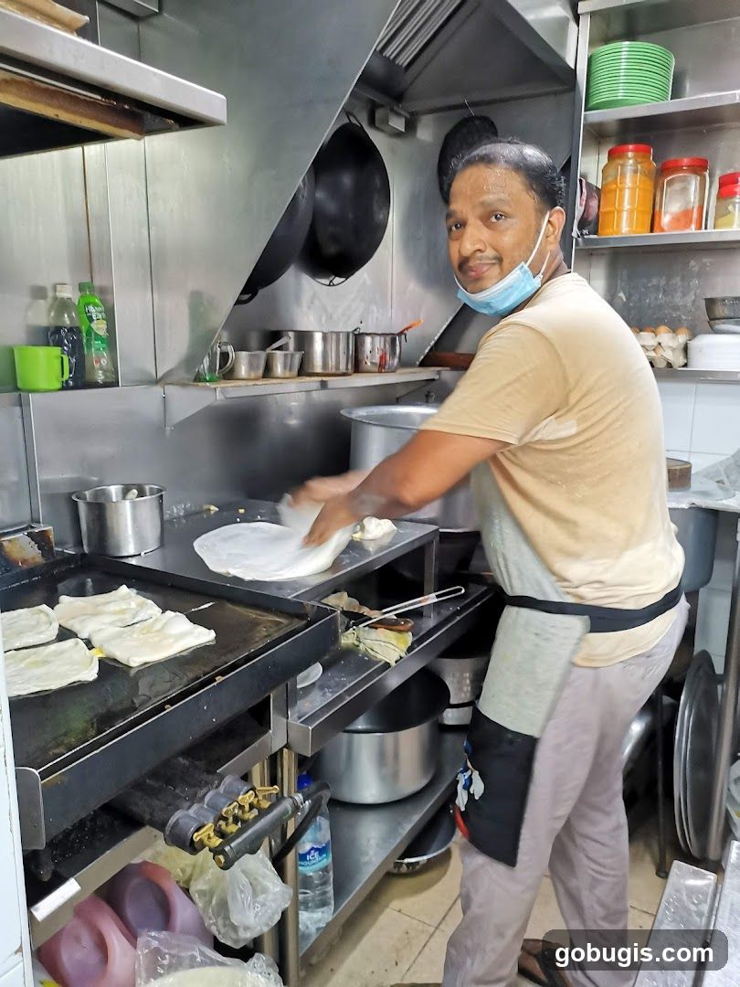 Cook preparing food in a kitchen