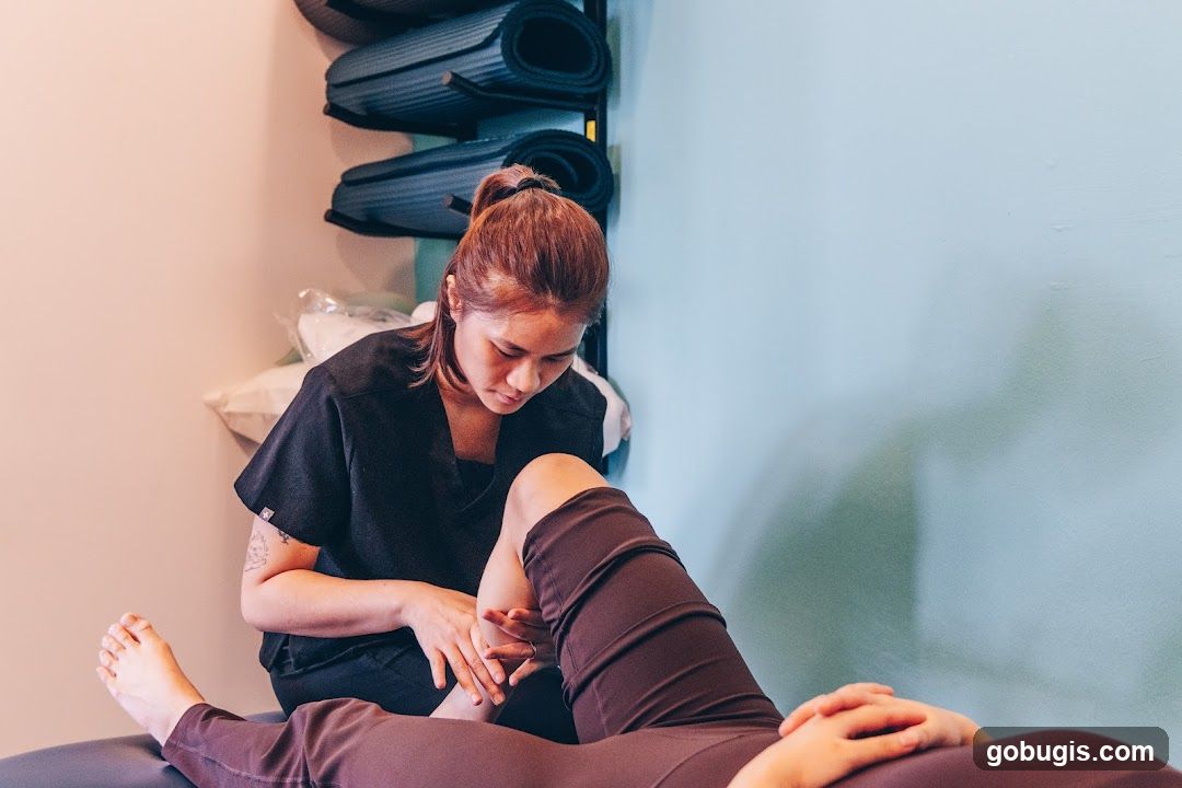 Physical therapist examining a patient's knee