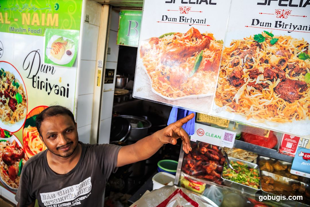 Man pointing at food display