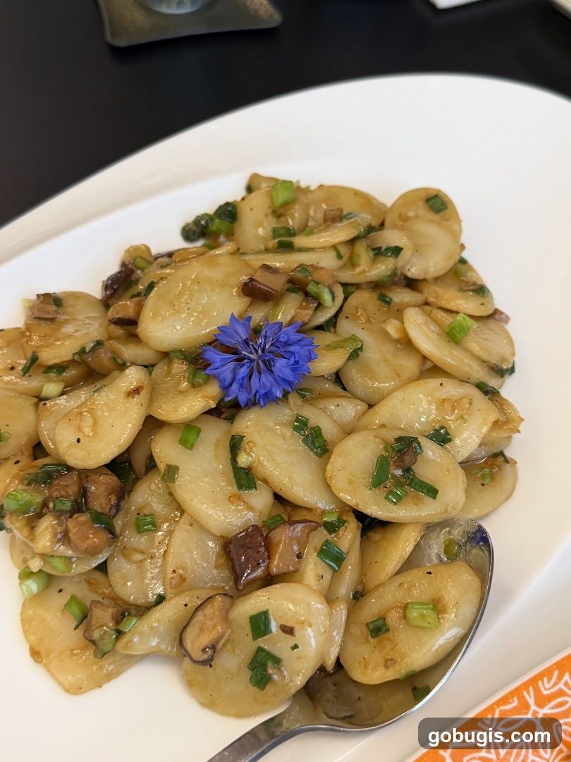 Stir-fried Rice Cakes with Mushrooms and Scallions
