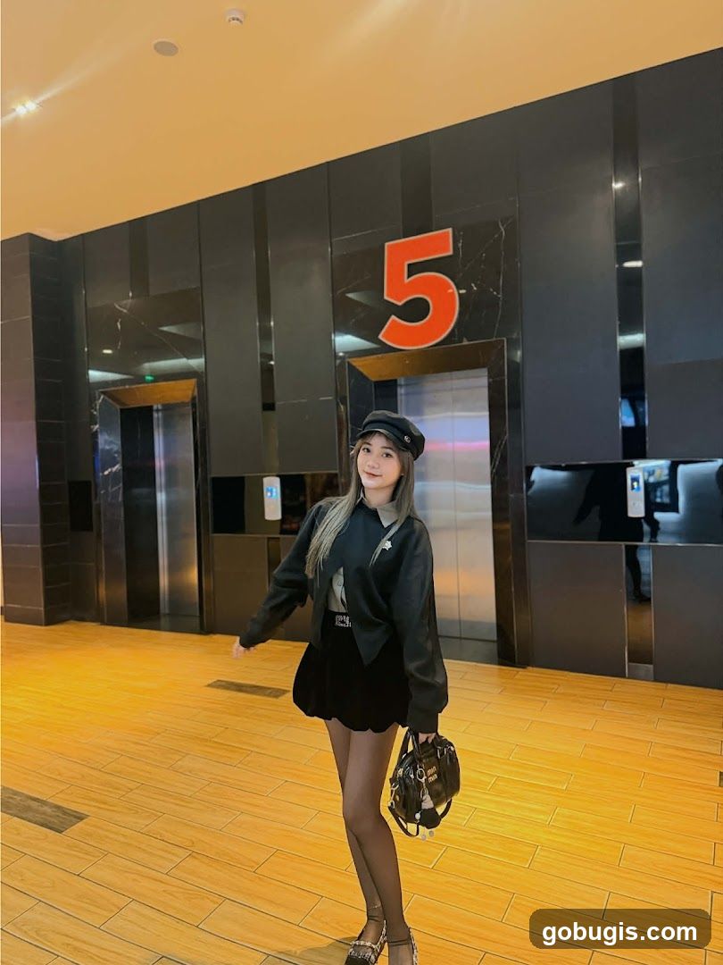 Woman Posing in Front of Elevators