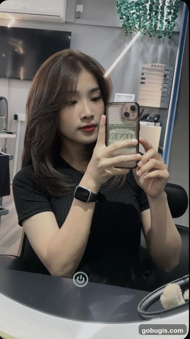 Woman taking a mirror selfie
