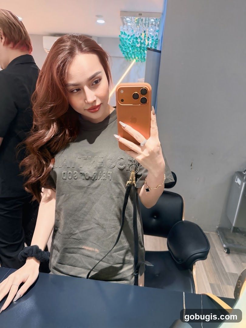 Woman taking a selfie in a salon