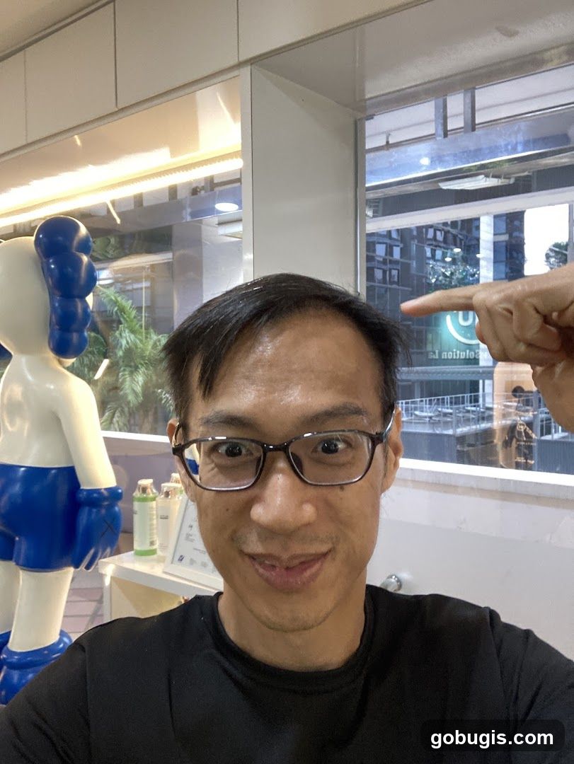 Man pointing at his head