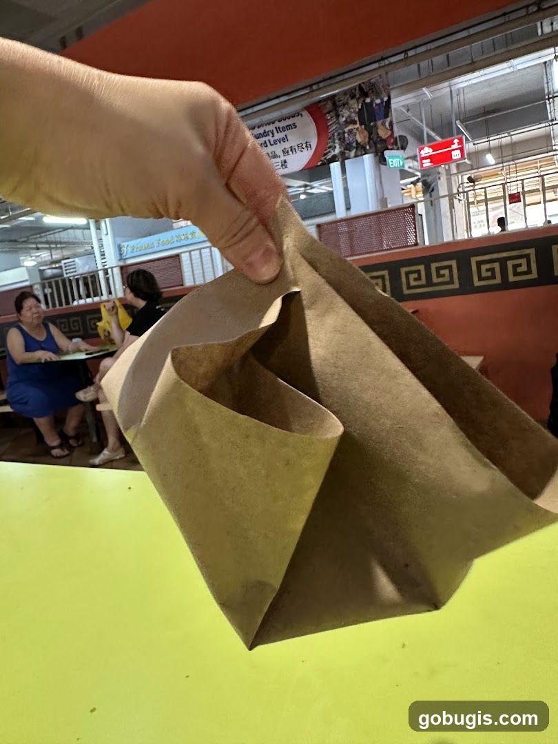 Brown paper bag held over a table