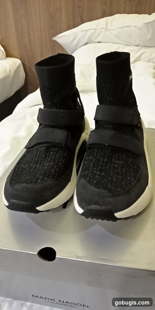 Black and white sneakers on a box