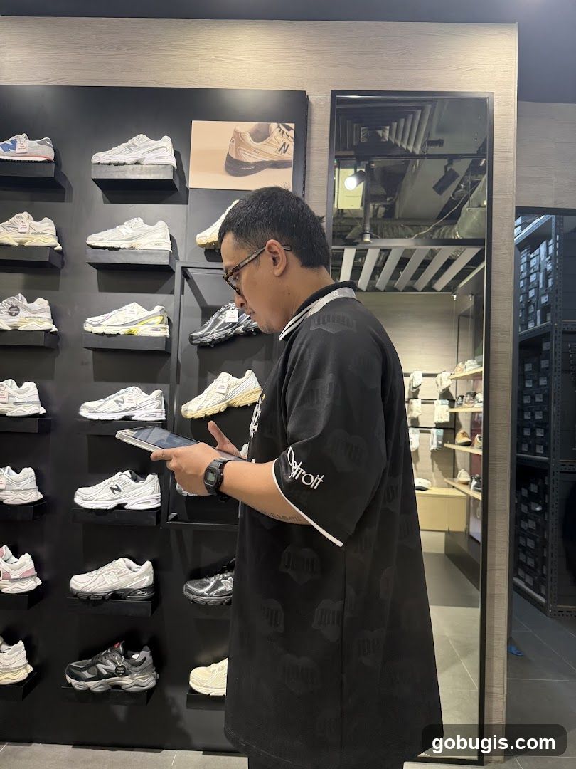 Man Browsing Shoes in a Store