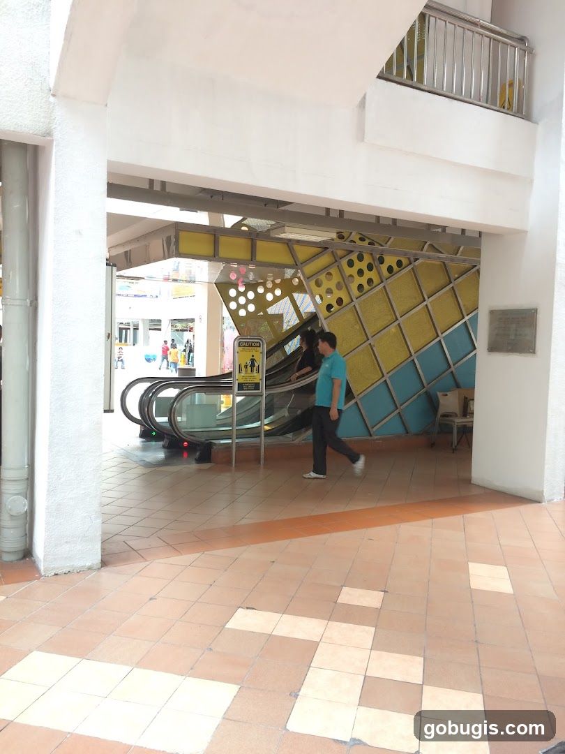 Escalator Entrance with Decorative Wall