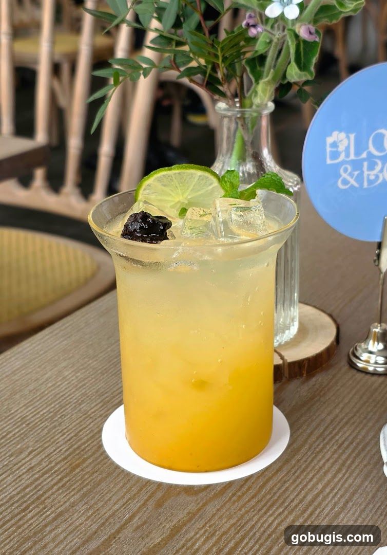 Yellow Drink with Lime and Cherry