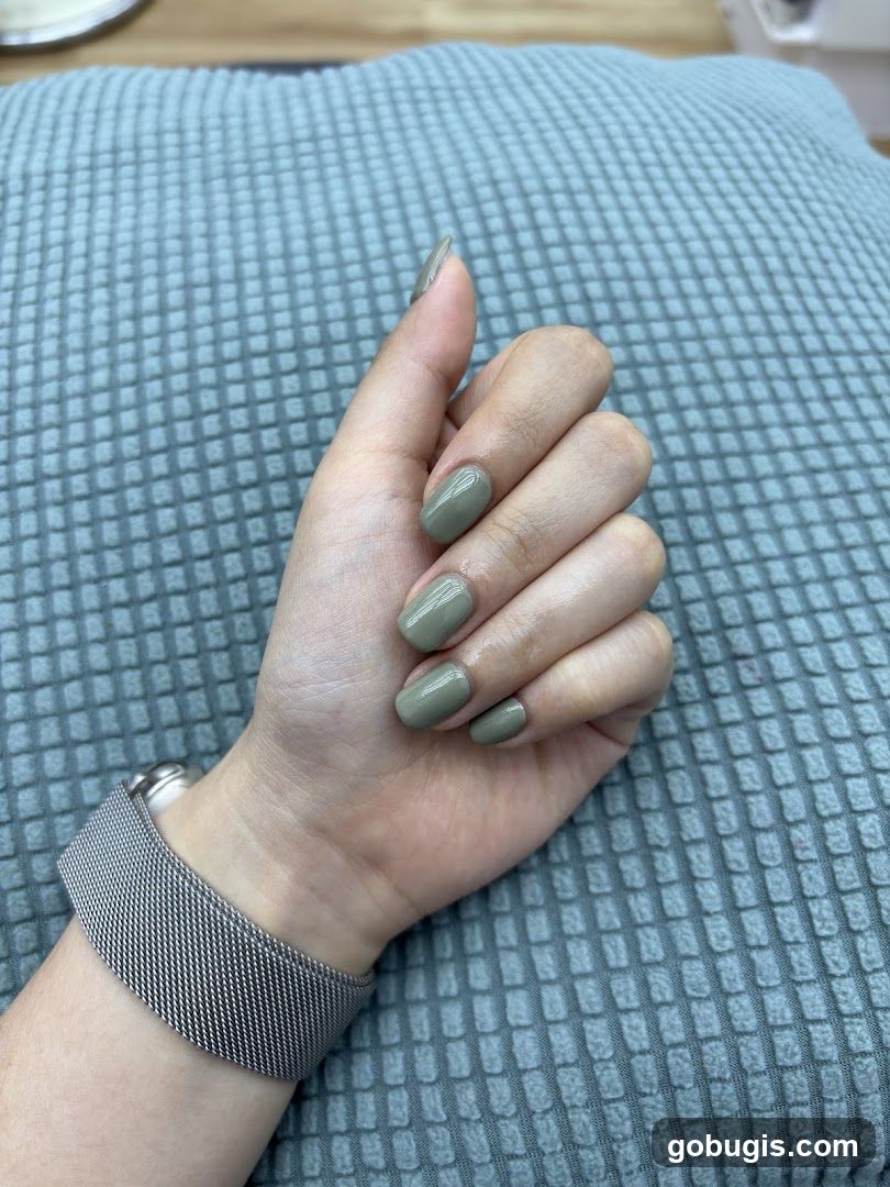 Woman's Hand with Green Nails