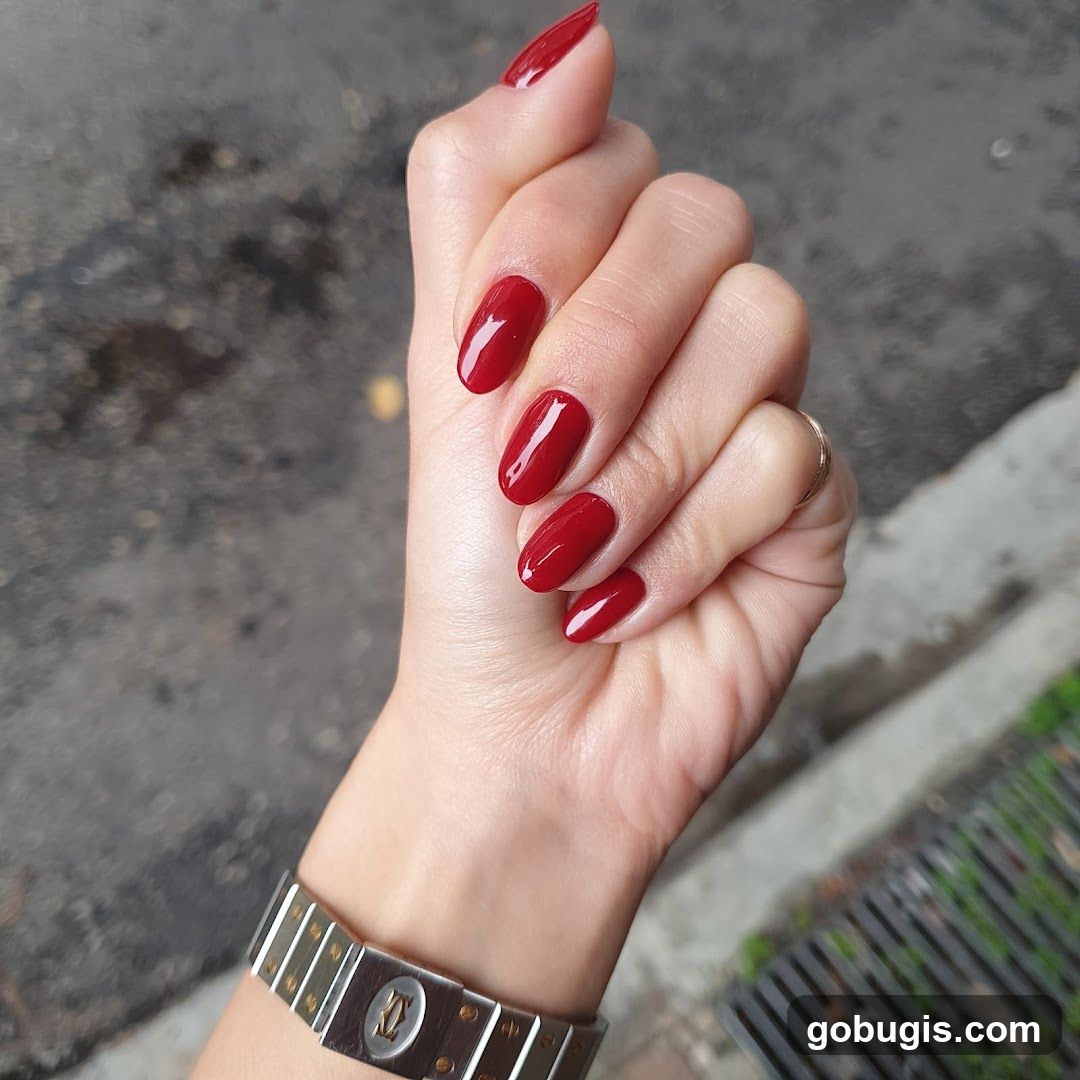 Hand with Red Nails and Watch