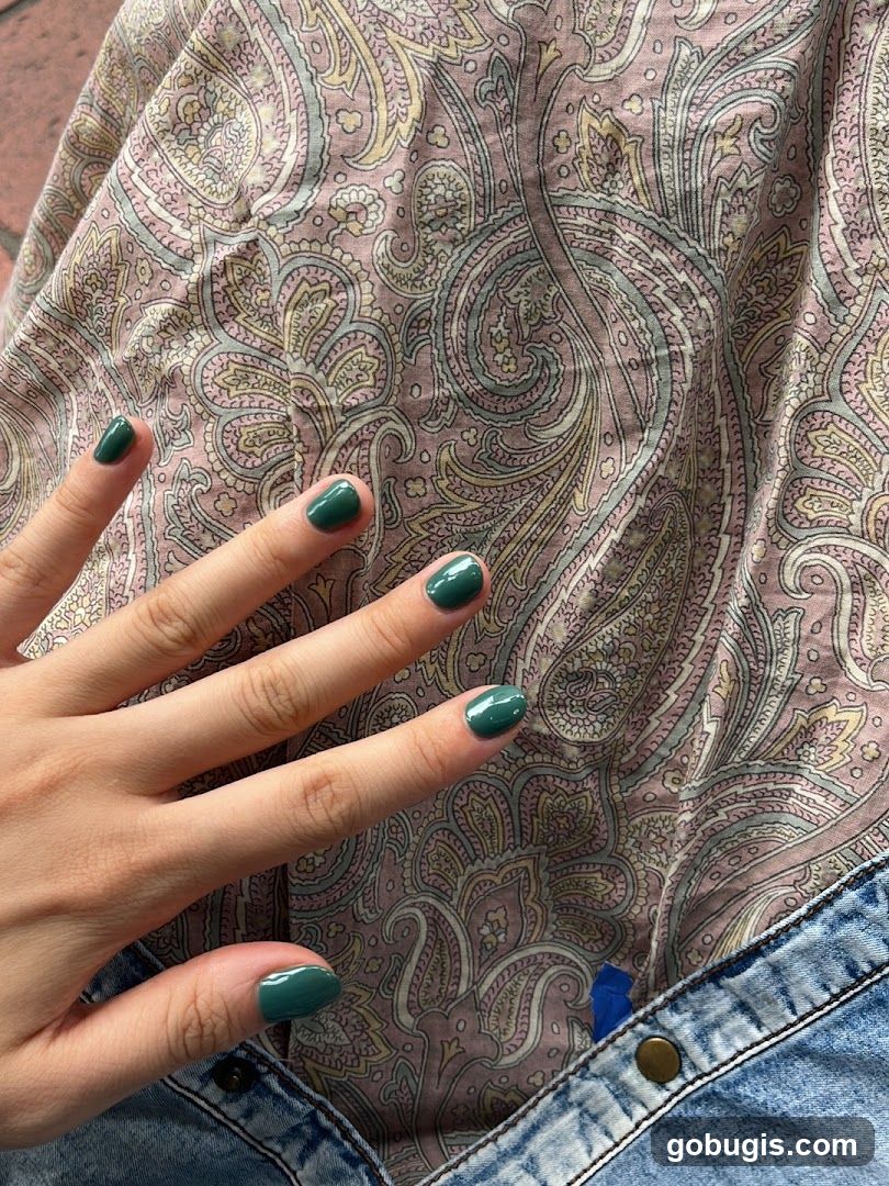 Hand with Green Nail Polish