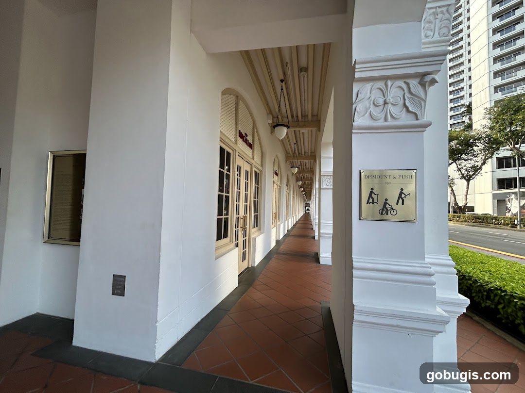 Colonnade with shops and signage