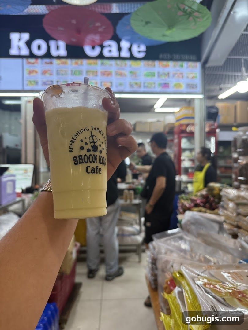 Person holding a refreshing tapioca drink