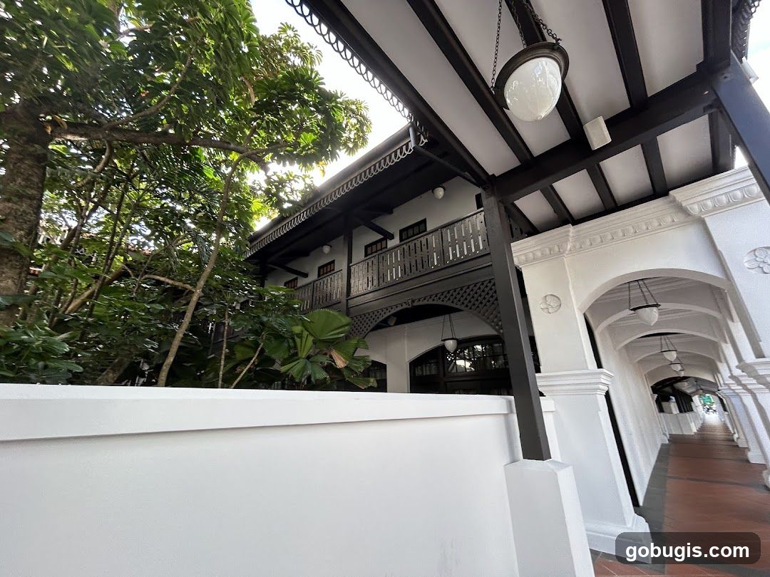 Covered walkway with arches and greenery