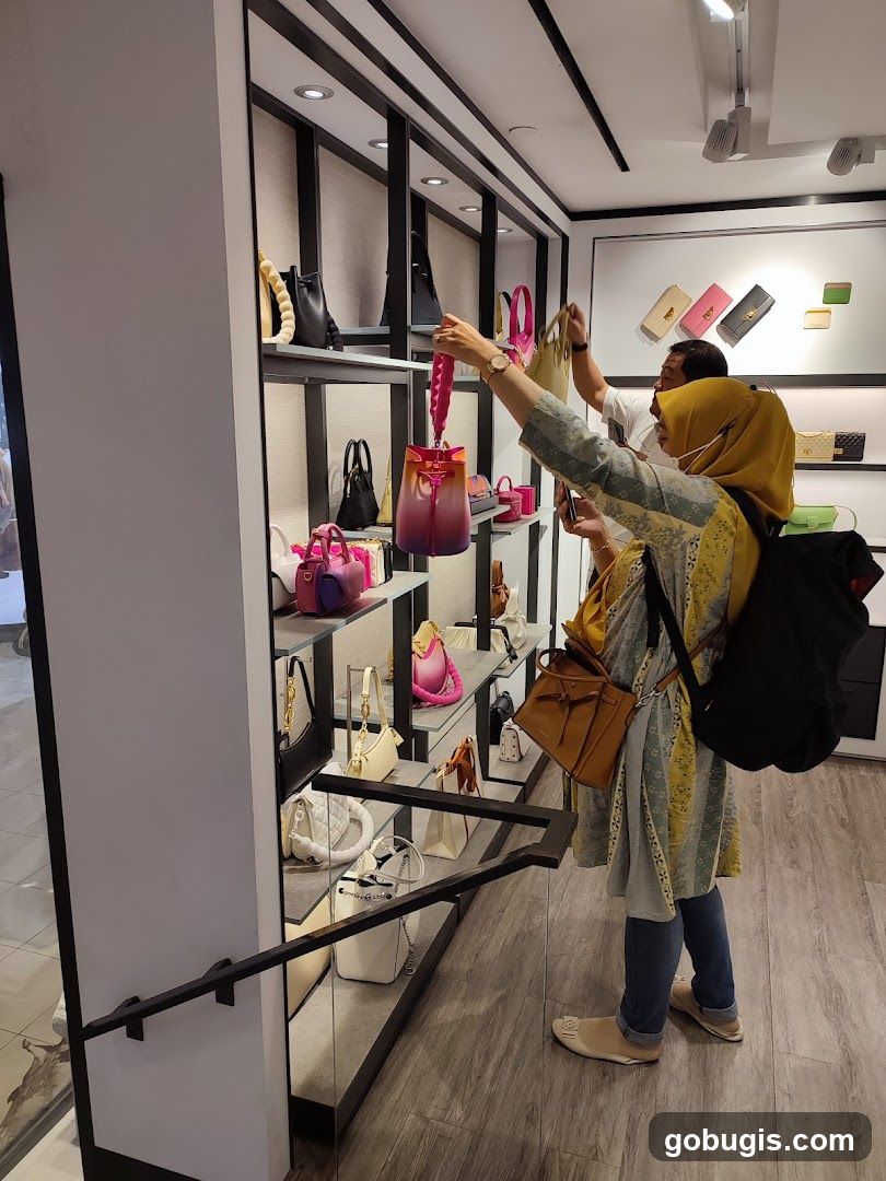 Customers browsing handbags in a store