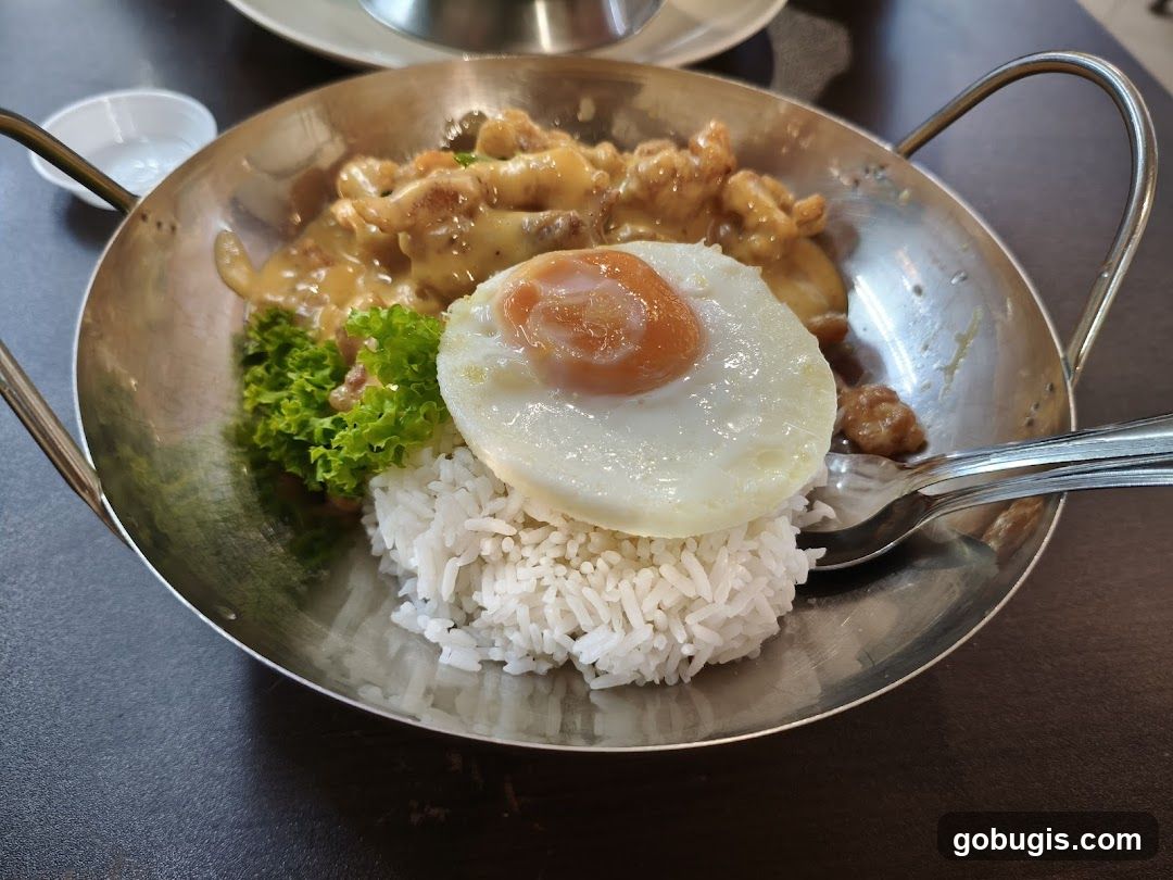 Chicken with cheese sauce and rice